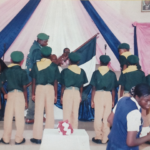 BOYS SCOUT RECEIVING A STAFF OF OFFICE